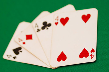 four old playing cards