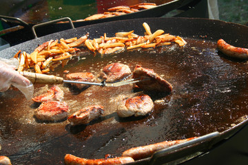roasted food. meat, potato, sausages.