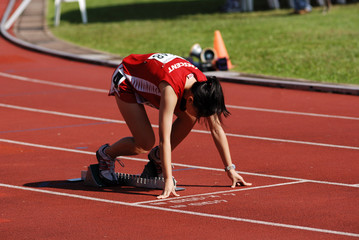 sportswoman running on the stadium