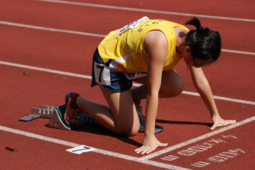 runner running on the track in the stadium