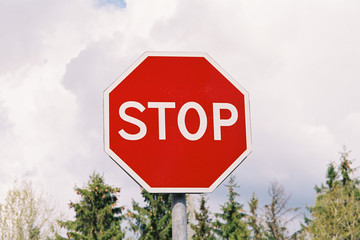 red stop sign with sky background