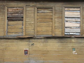 boarded windows in wooden house