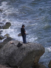 man standing on a rock