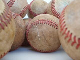 a bunch of old baseballs – one of four in series