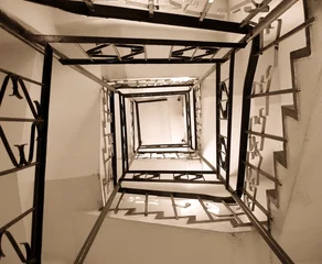 Selbstklebende Fototapeten old winding stairwell © Yali Shi