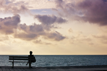 Fototapeta premium woman bench sunset
