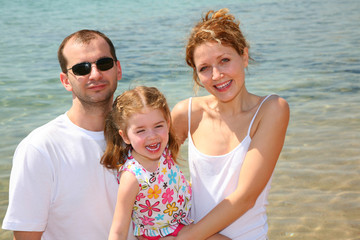 Fototapeta na wymiar happy family on a beach