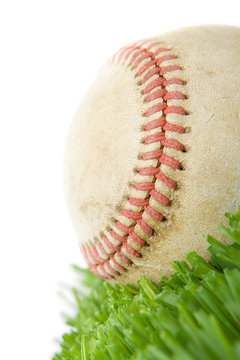 softball in grass close up