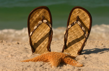 sandals and starfish at the beach