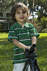 young boy with tripod