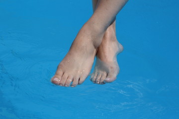 beautiful female legs in water