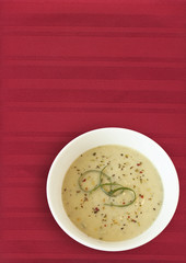 leak soup on red placemat
