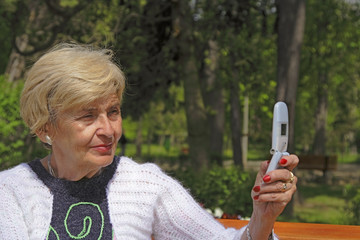 senior woman with camera phone