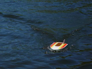 Fotobehang gestreepte motorboot © Galaiko Sergey