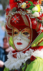man in colorful venetian mask