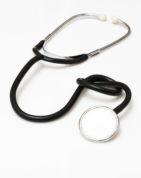 stethoscope isolated on white having a knot