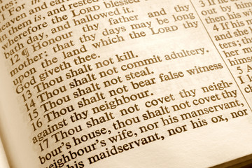 close up of the 10 commandments in an old bible.