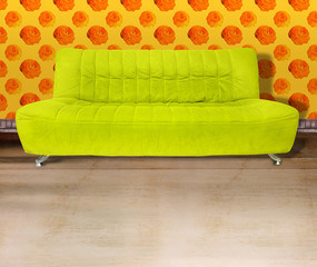 lime green couch against flower wallpaper