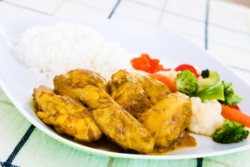curried chicken with rice and vegetables - jamaica