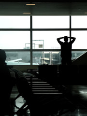 Traveler watching airplanes in airport