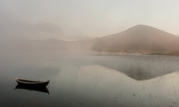 boat, mountains and midnight's fog