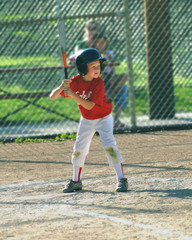 child playing baseball