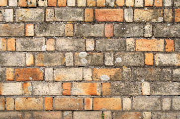 old brick wall with varied sized and colored brick