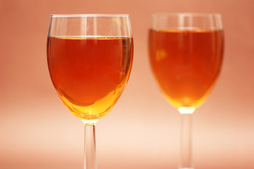 two wine glasses on the biege background