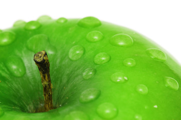 green apple with water drops isolated on white