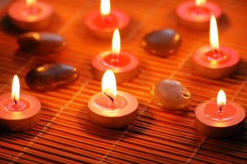 aromatic candles and  pebbles for spa session