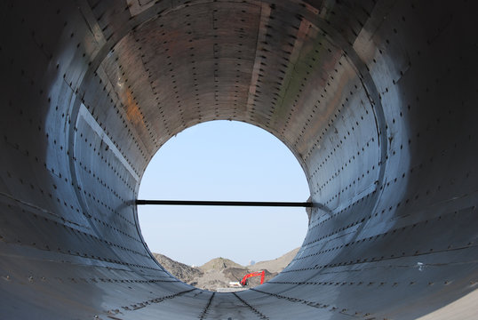 Construction Pipe with backend loader in distance
