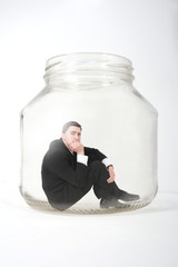 businessman  in the jar
