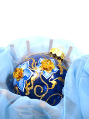 blue Christmas ball with gold on background