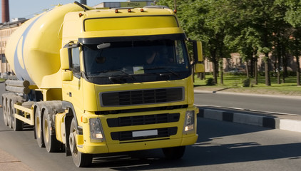 semi-tractor truck deliver concrete  to construction site 