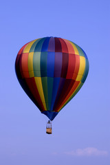  hot air balloon floating peacefully in the blue sky