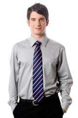 A young businessman in shirt and tie on white background