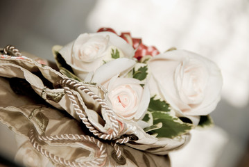 the brides corsage with a purse on the table