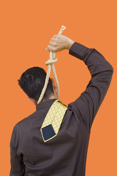 A businessman triying to hang him self