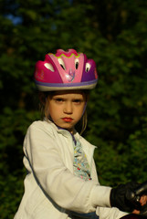 Girl With Bycicle Helmet and Forest in Background