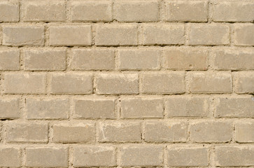 Fragment of new brick wall with stucco