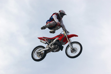 Obraz na płótnie Canvas motorcyclist in air 