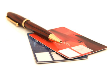 two credit cards with pen