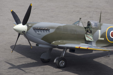 A British Spitfire fighter plane stands ready for action.