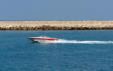 speedy rapid little boat passing by