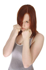 red haired teen in aggressive fighting stance