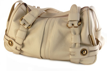 A isolated beige leather handbag