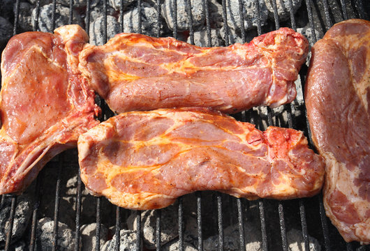 Close shot of hot fresh meat on grill