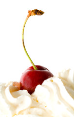 Sweet cherry in a cream. Isolation on white