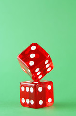 red dies on the green background