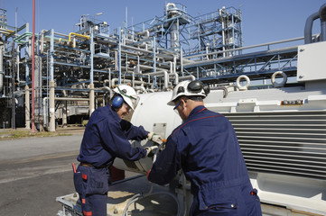 engineers working inside oil refiney